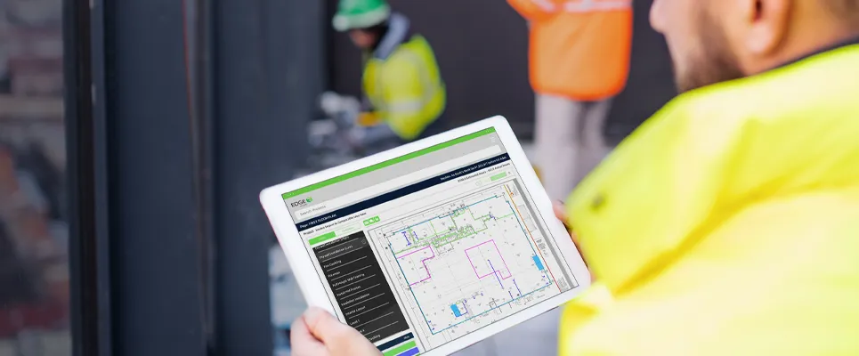 contractor looking at the jobsite management app, The EDGE
